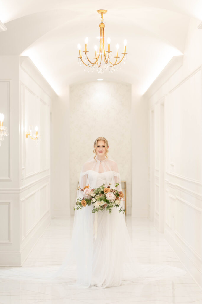 north texas bride in beautiful white corridor with bouquet