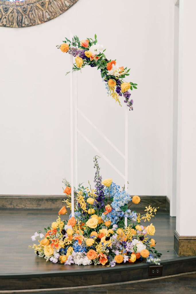 Detailed view of the altar floral installation with vibrant flowers, designed by Kendra’s Events.