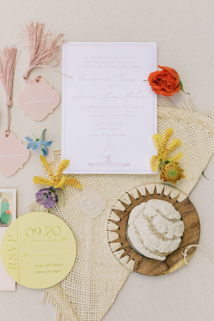 Elegant wedding invitation adorned with vibrant floral accents, designed by Kendra’s Events.